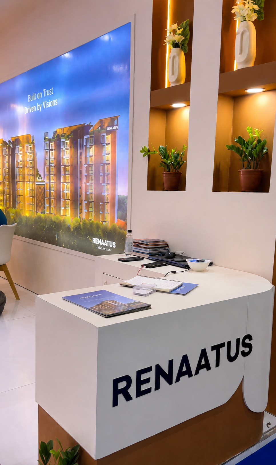 Renaatus stall - reception counter and backlit project visuals